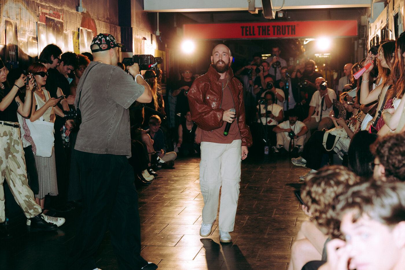 Allen Witcher on the runway with Tell The Truth signage